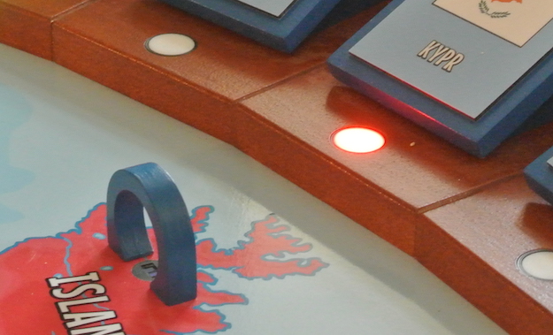 This picture shows detail of wooden gate, IR photo-interrupter with plastic adapter and RGB LED with national flag.